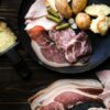 Quelle charcuterie pour une raclette ? Le guide pour un festin assuré